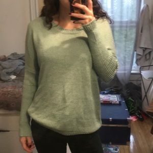 Blue sweater with rip down the back